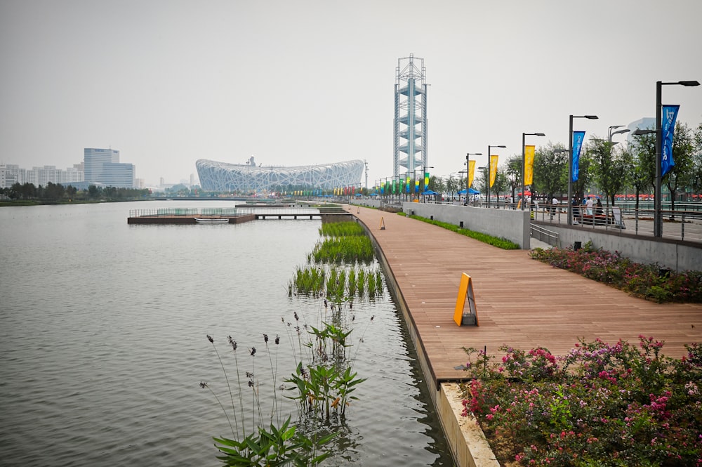 a boardwalk next to a large body of water