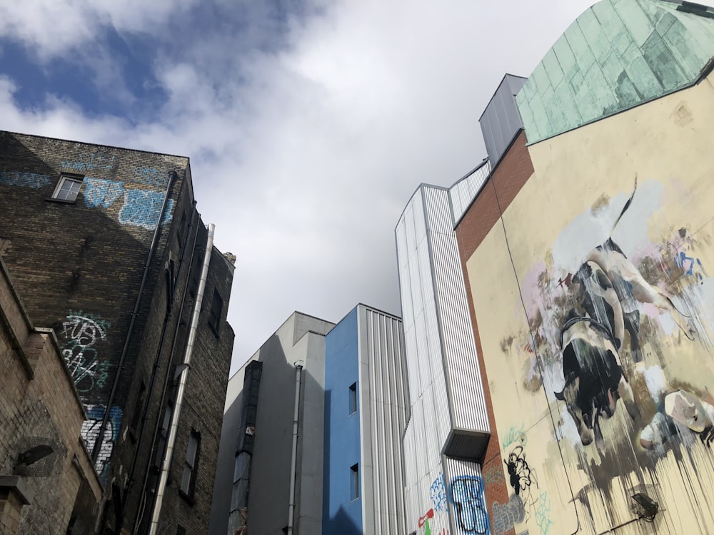 a group of buildings with graffiti on them