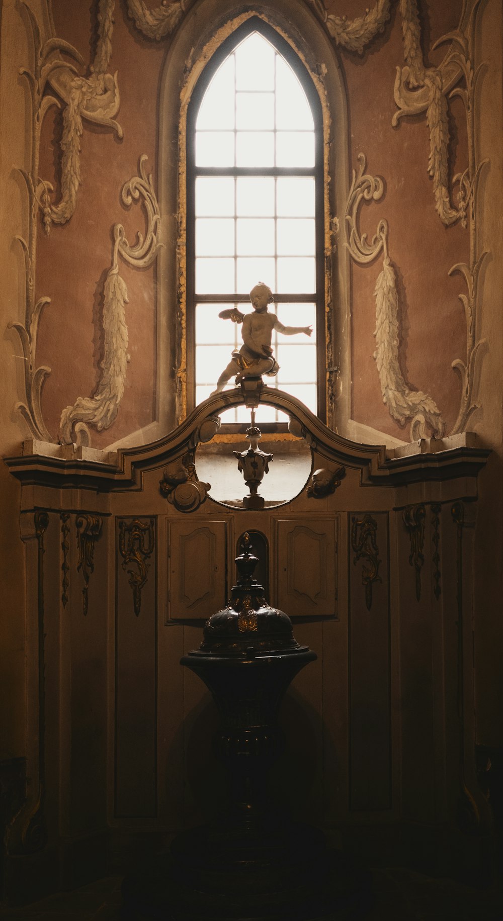 a fountain in front of a window in a building