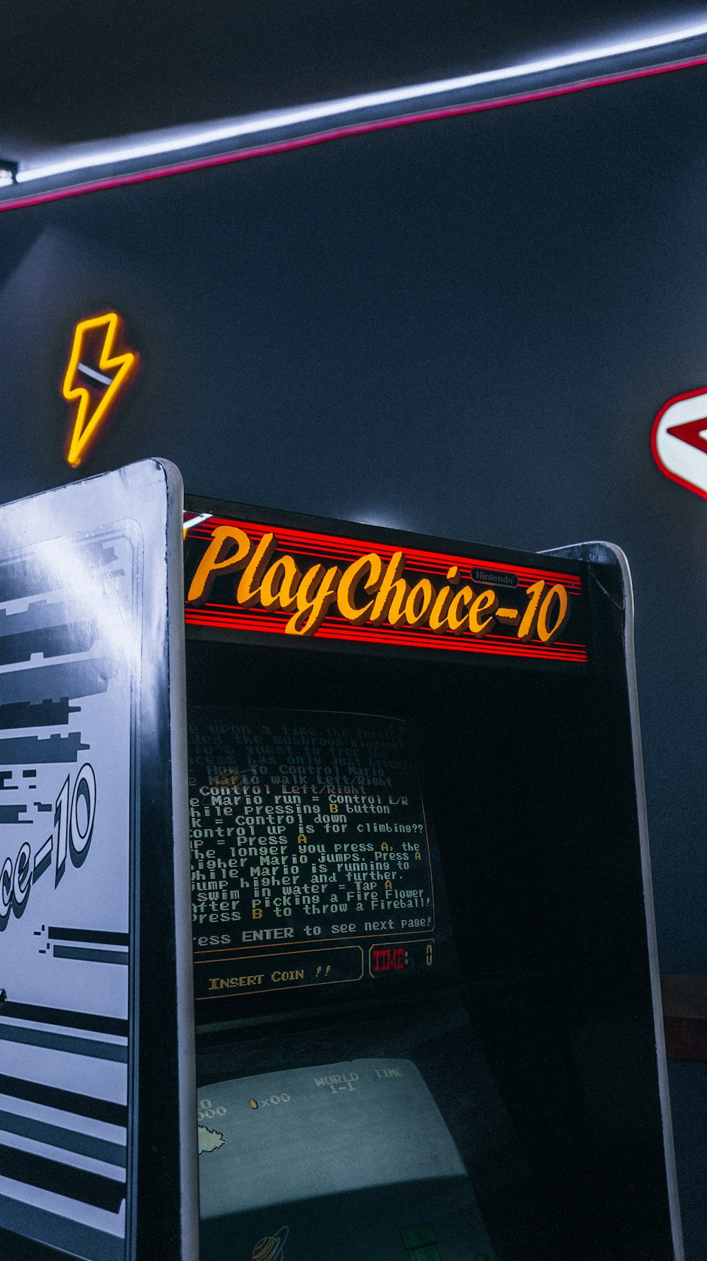 a close up of a vending machine with neon signs