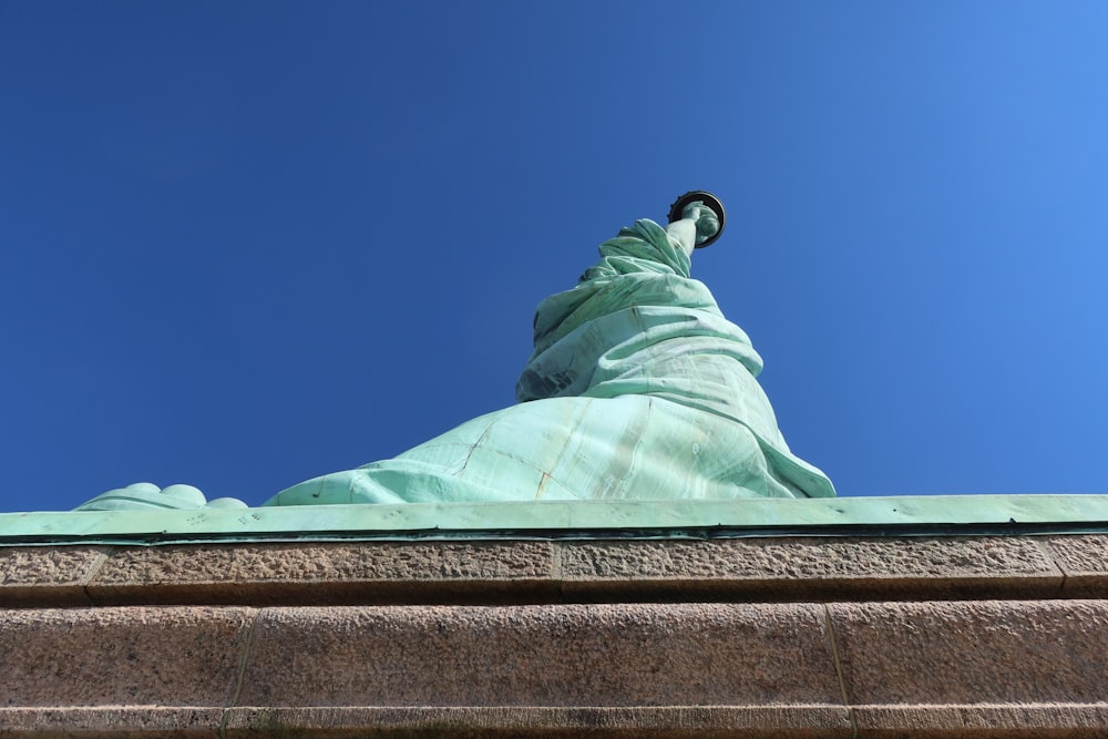 a view of the statue of liberty from below
