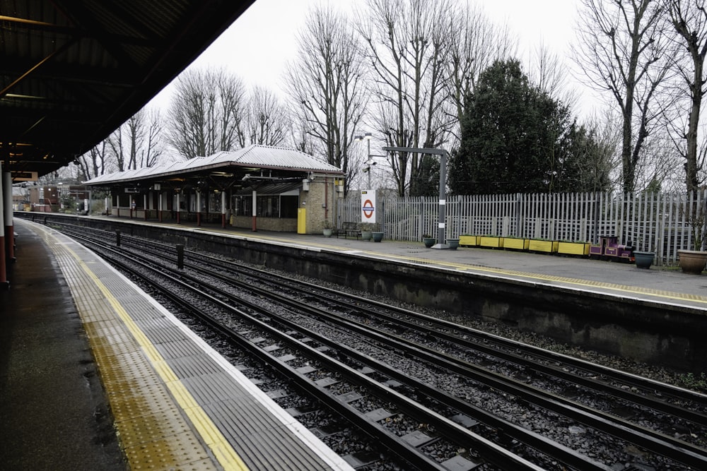 a train station with a train on the tracks