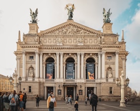 a group of people standing in front of a building