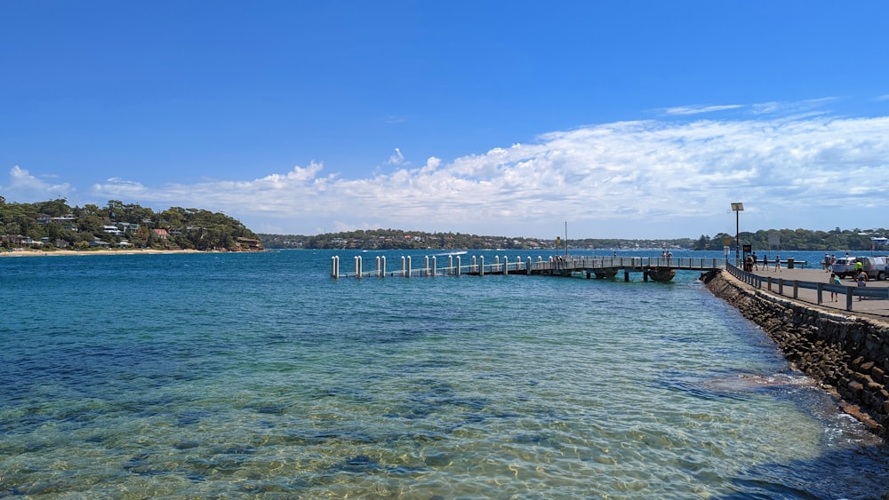 a pier that is next to a body of water