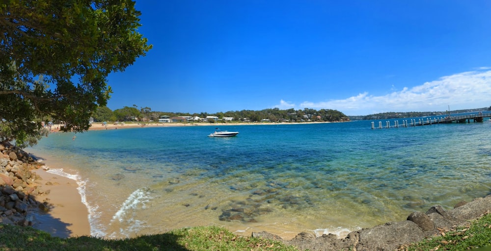 a beach with a boat in the water