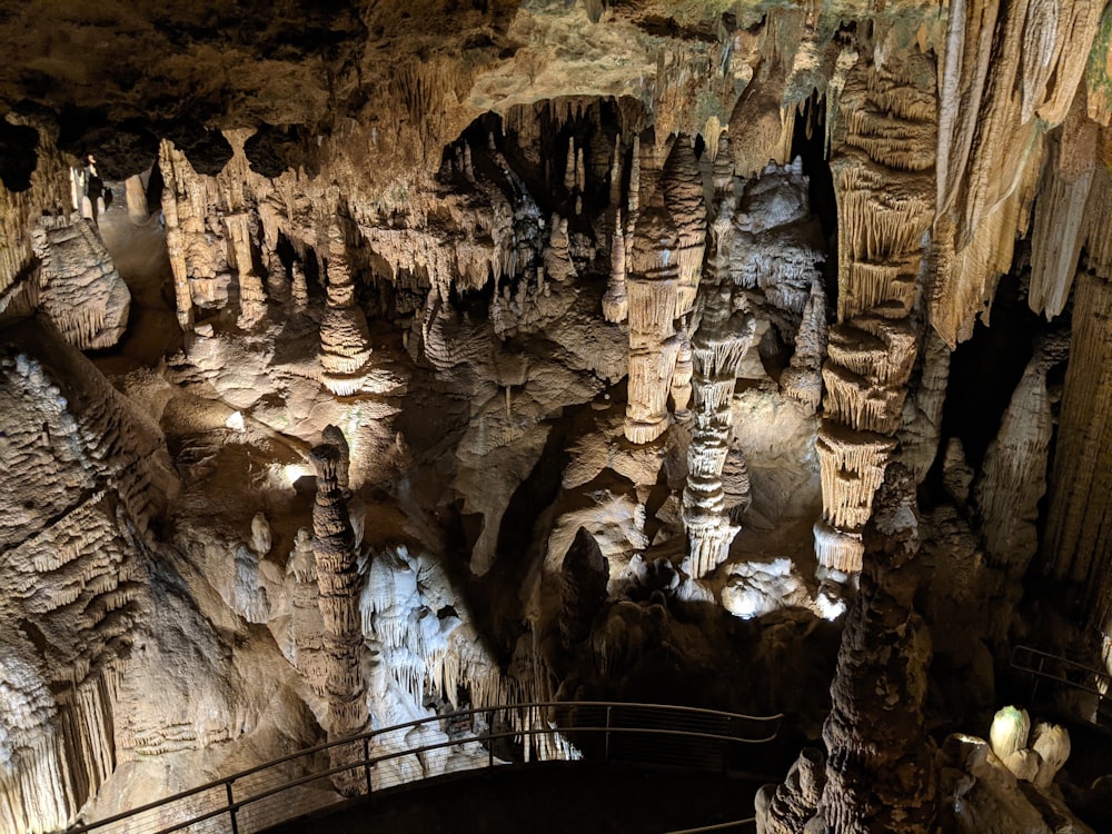 a group of people standing in a cave