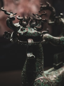 Large bronze sculpture in progress, showcasing intricate details and scale inside the foundry.