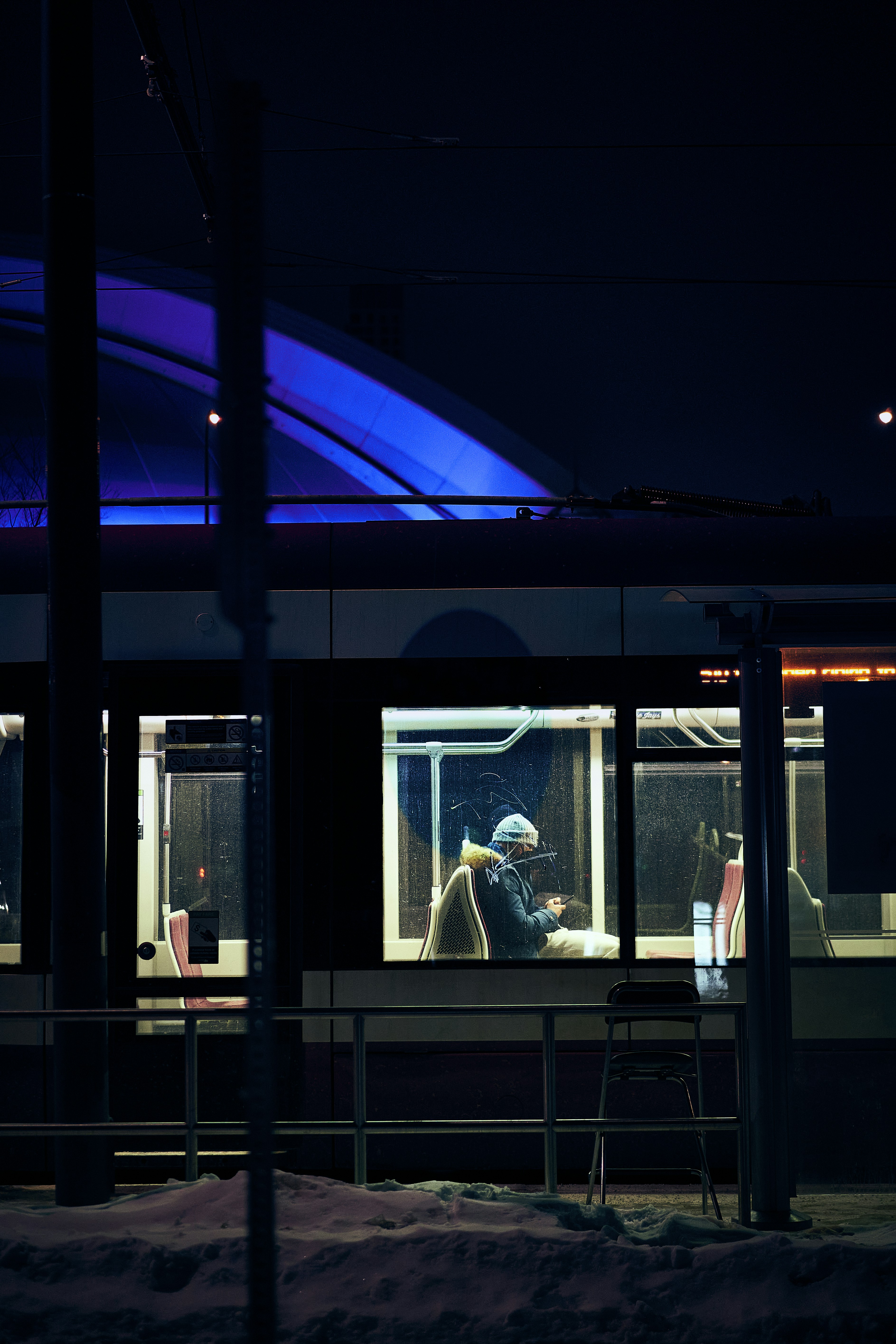 a man sitting at a table in front of a window