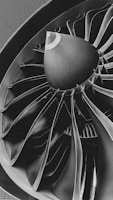 a black and white photo of a turbine