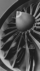 a black and white photo of a turbine