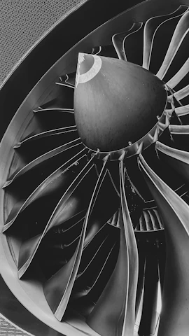 a black and white photo of a turbine
