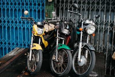 two motorcycles are parked next to each other