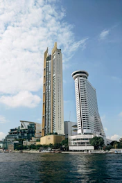 a couple of tall buildings sitting next to each other