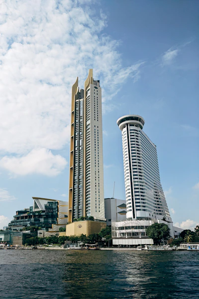 a couple of tall buildings sitting next to each other