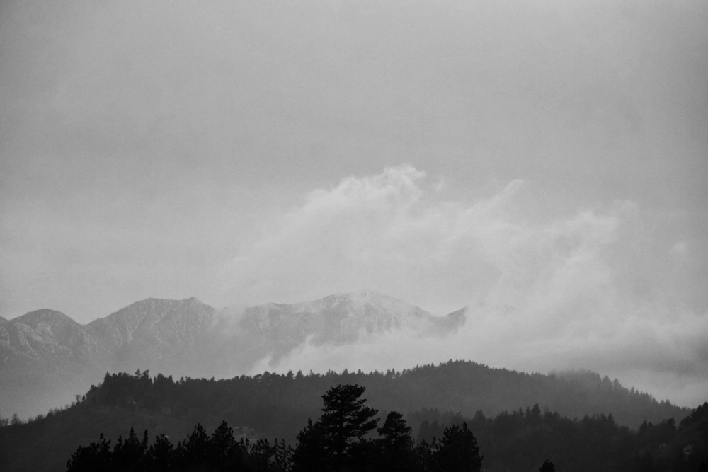 a black and white photo of a mountain range