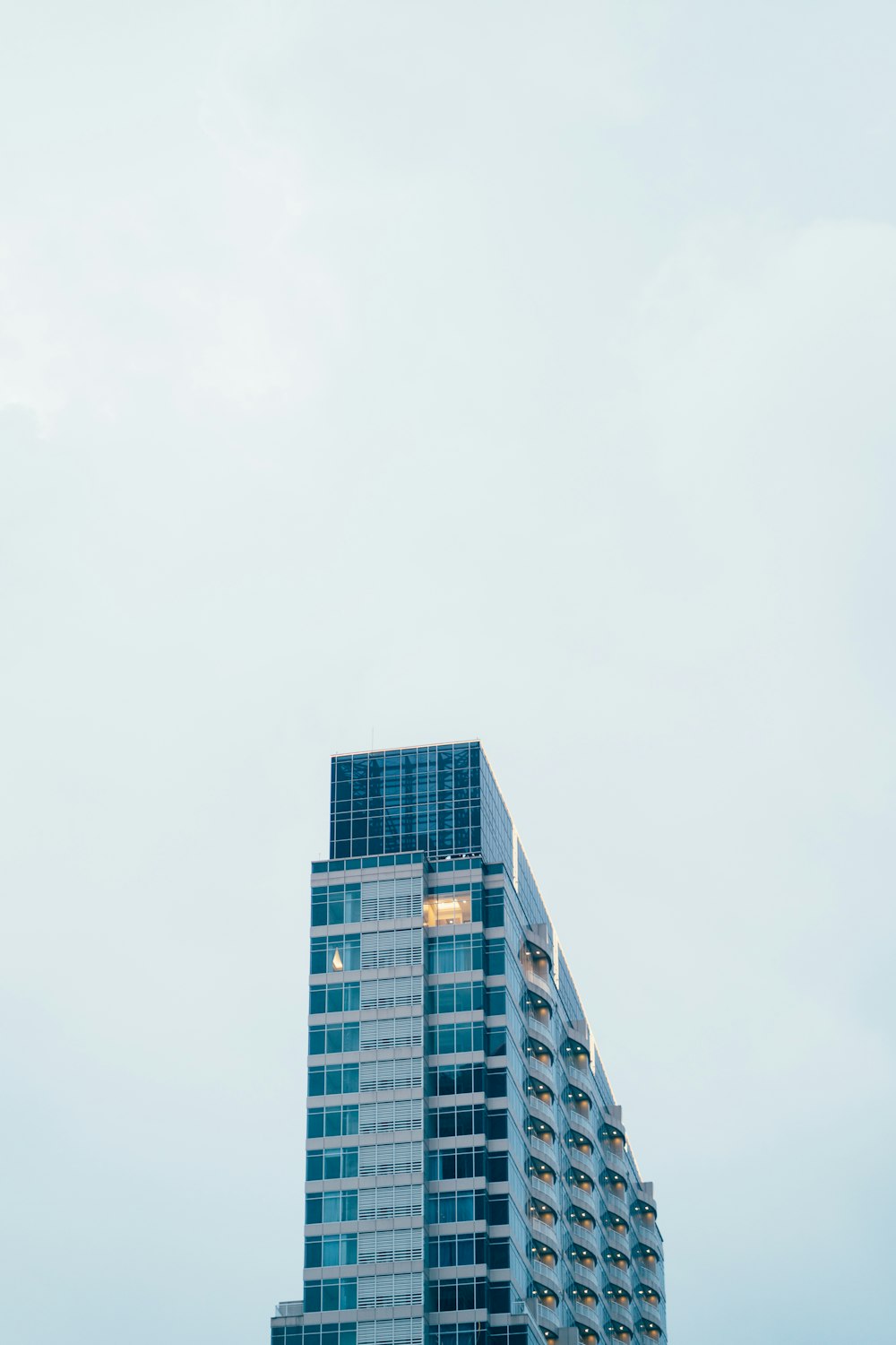 a very tall building with a sky in the background