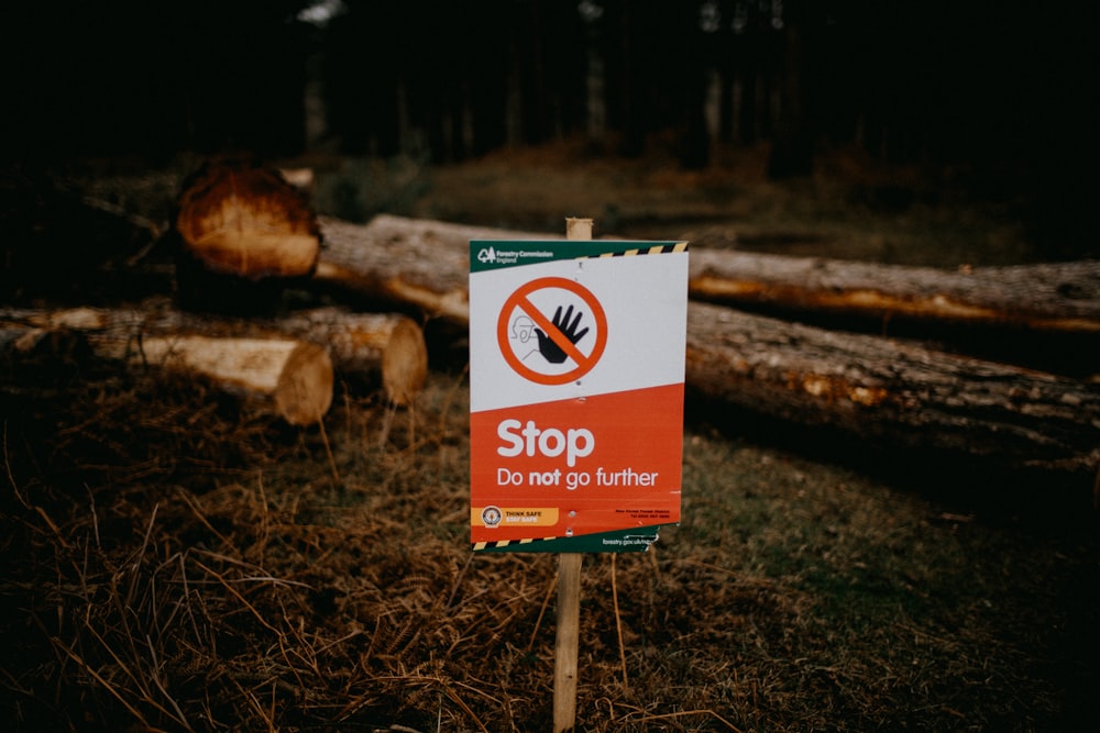 a sign that is sitting in the grass