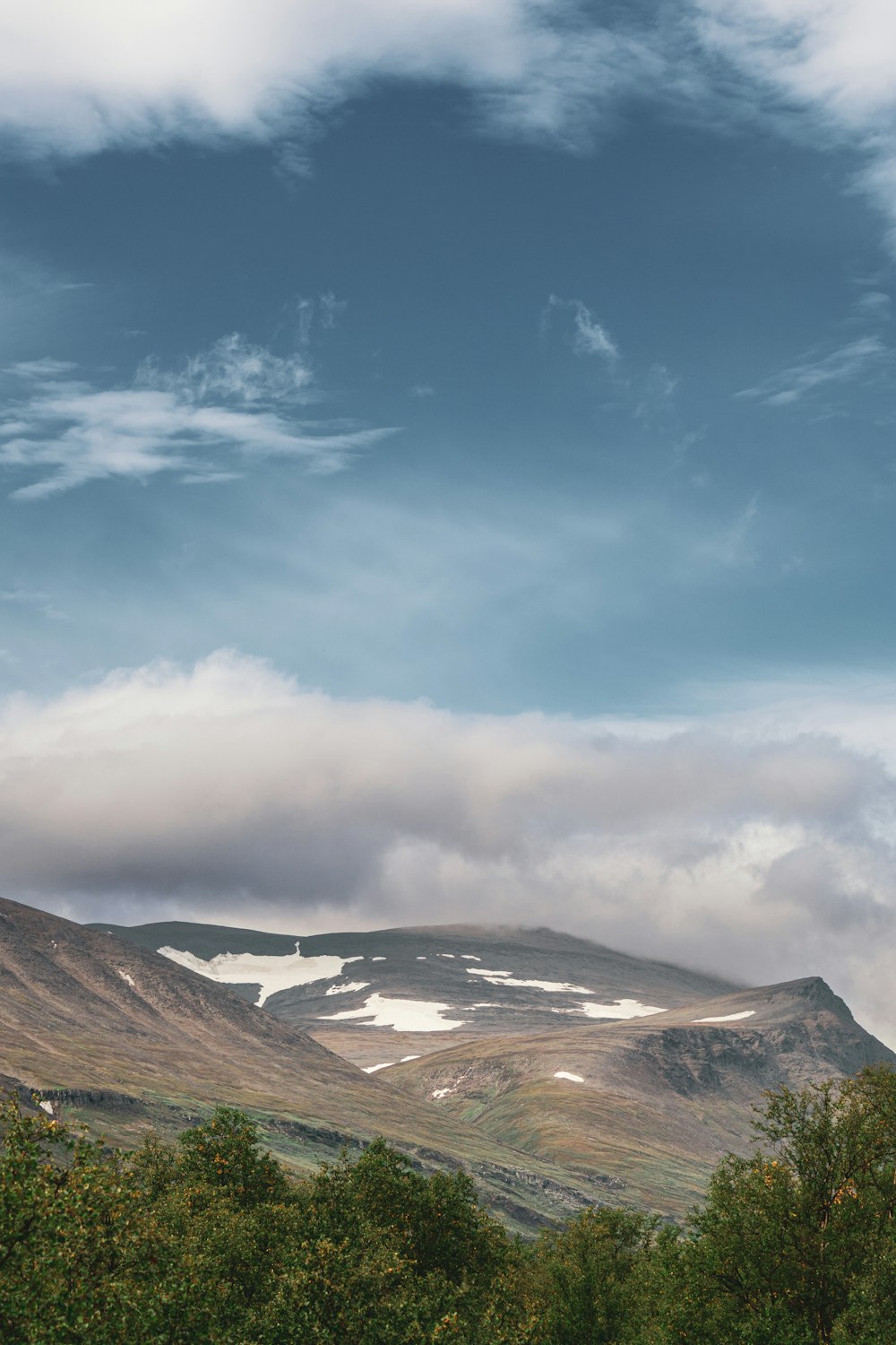 a mountain range with snow on the top of it