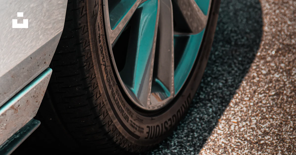 A close up of a car tire on a street photo – Free Tire Image on Unsplash