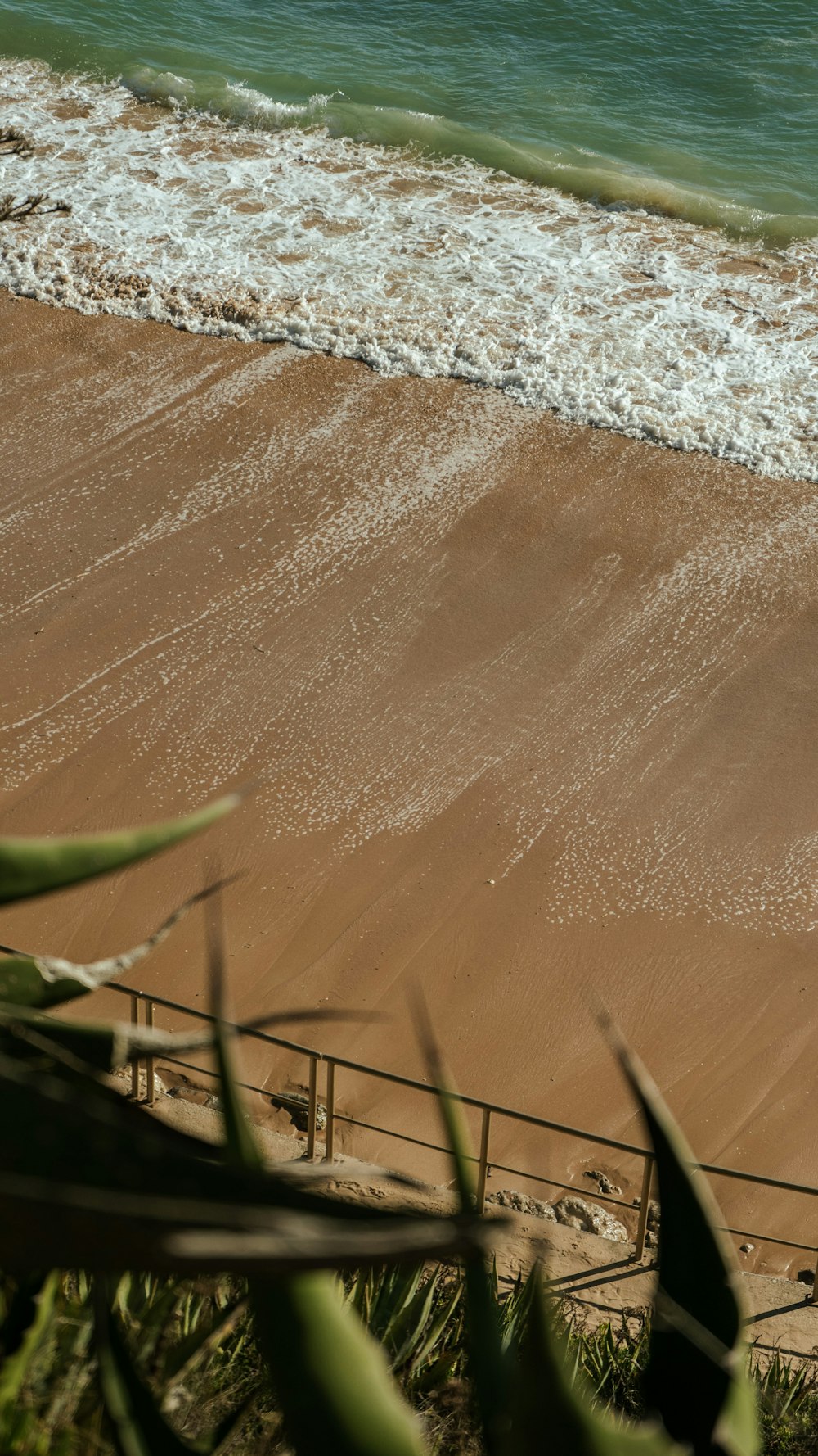 a person riding a surf board on a beach