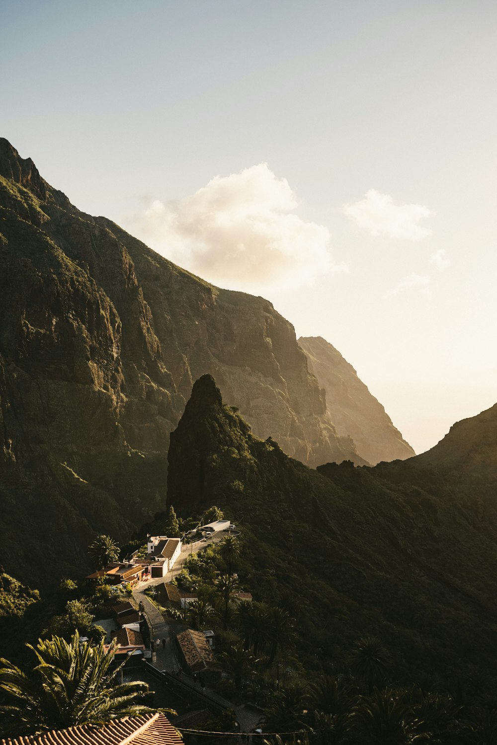 a view of a mountain with a house in the foreground