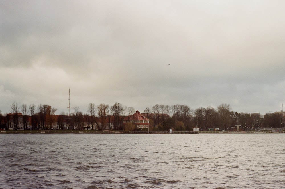 a body of water with buildings in the background