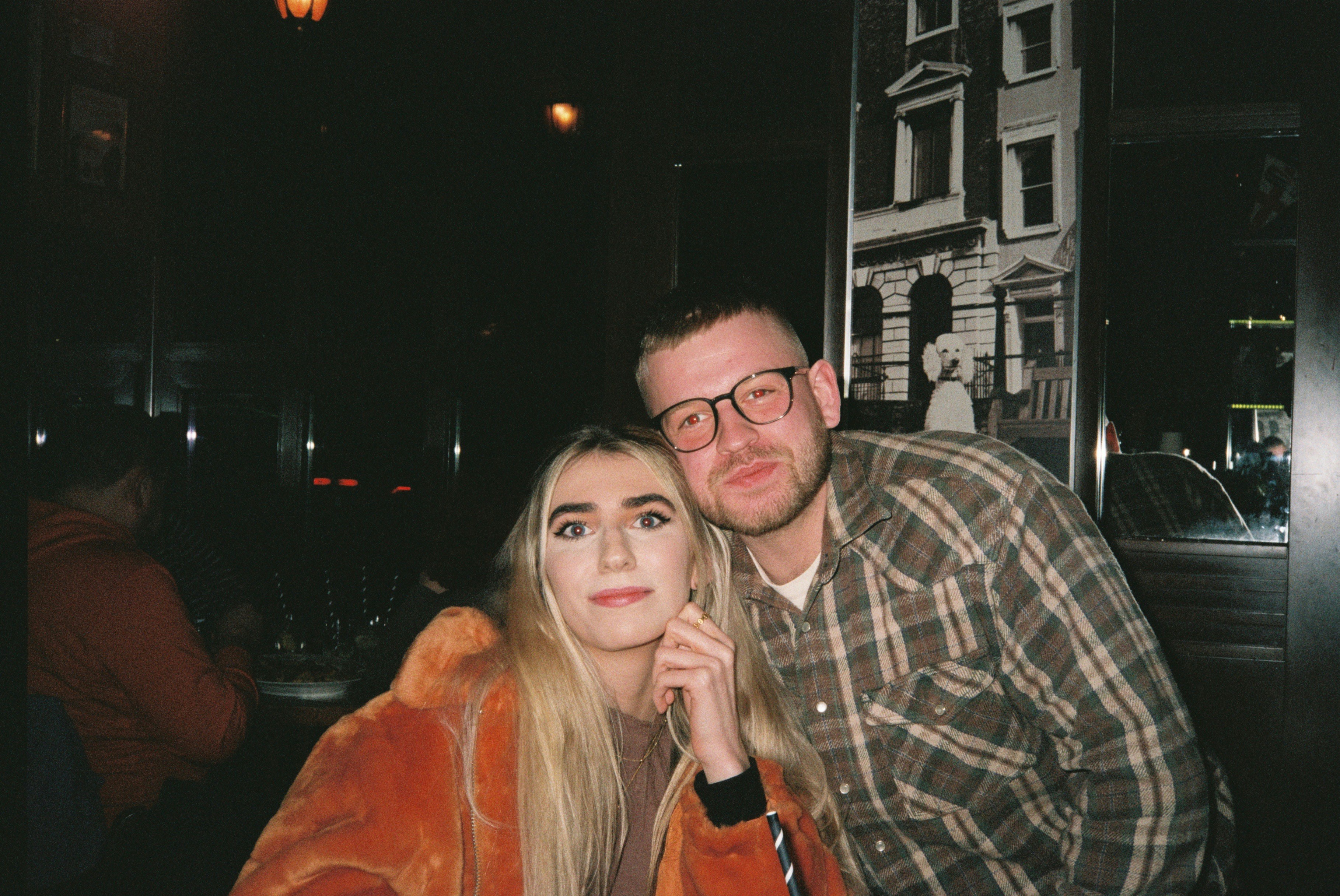 a man and a woman posing for a picture