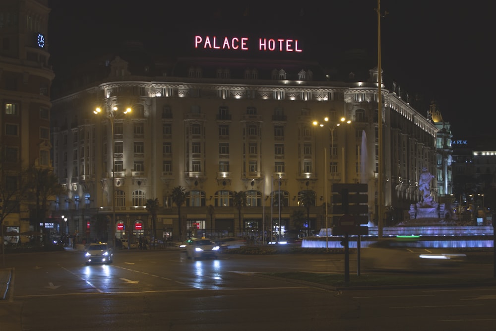 the palace hotel is lit up at night