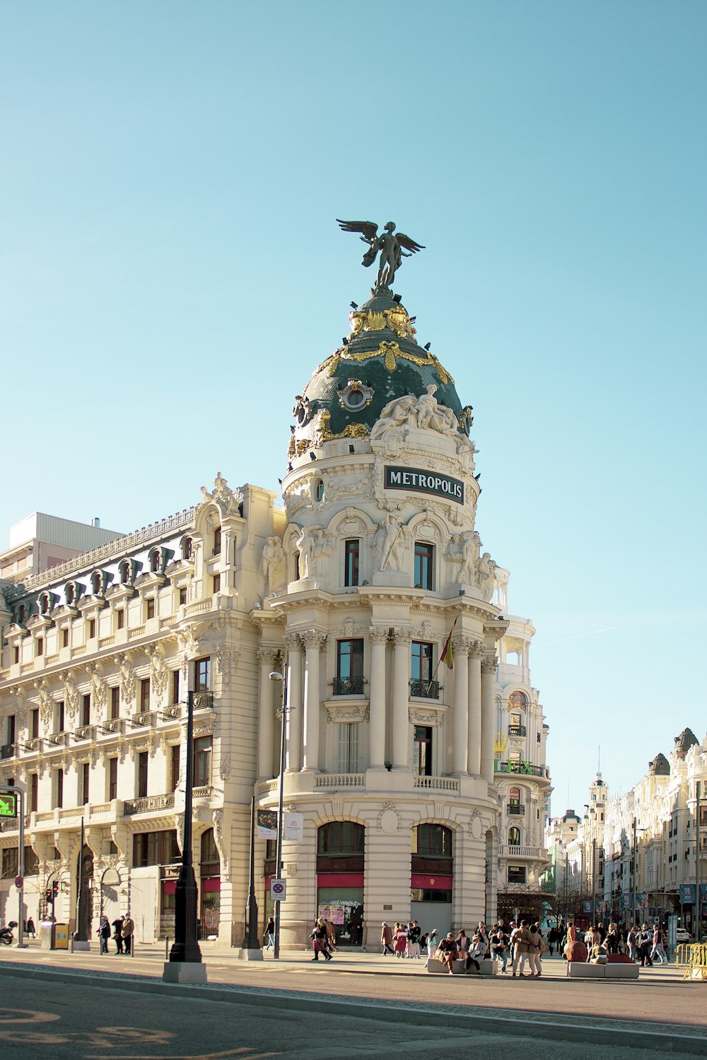 a large building with a statue on top of it