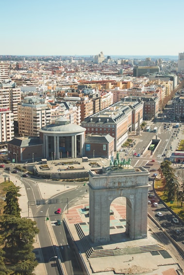 an aerial view of a city with a clock tower
