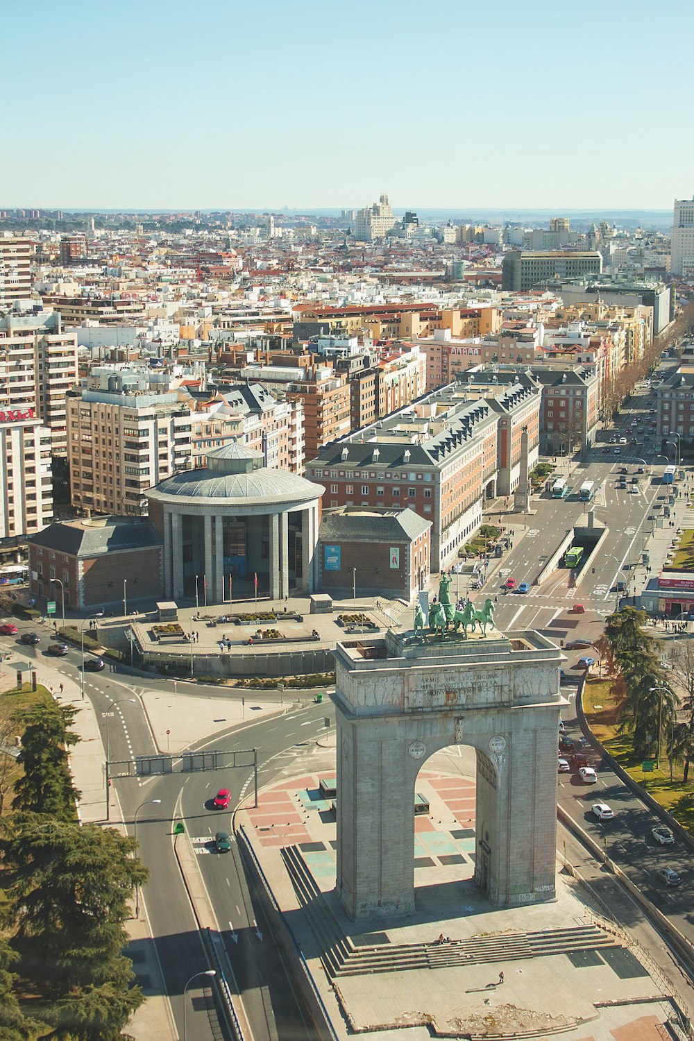 an aerial view of a city with a clock tower