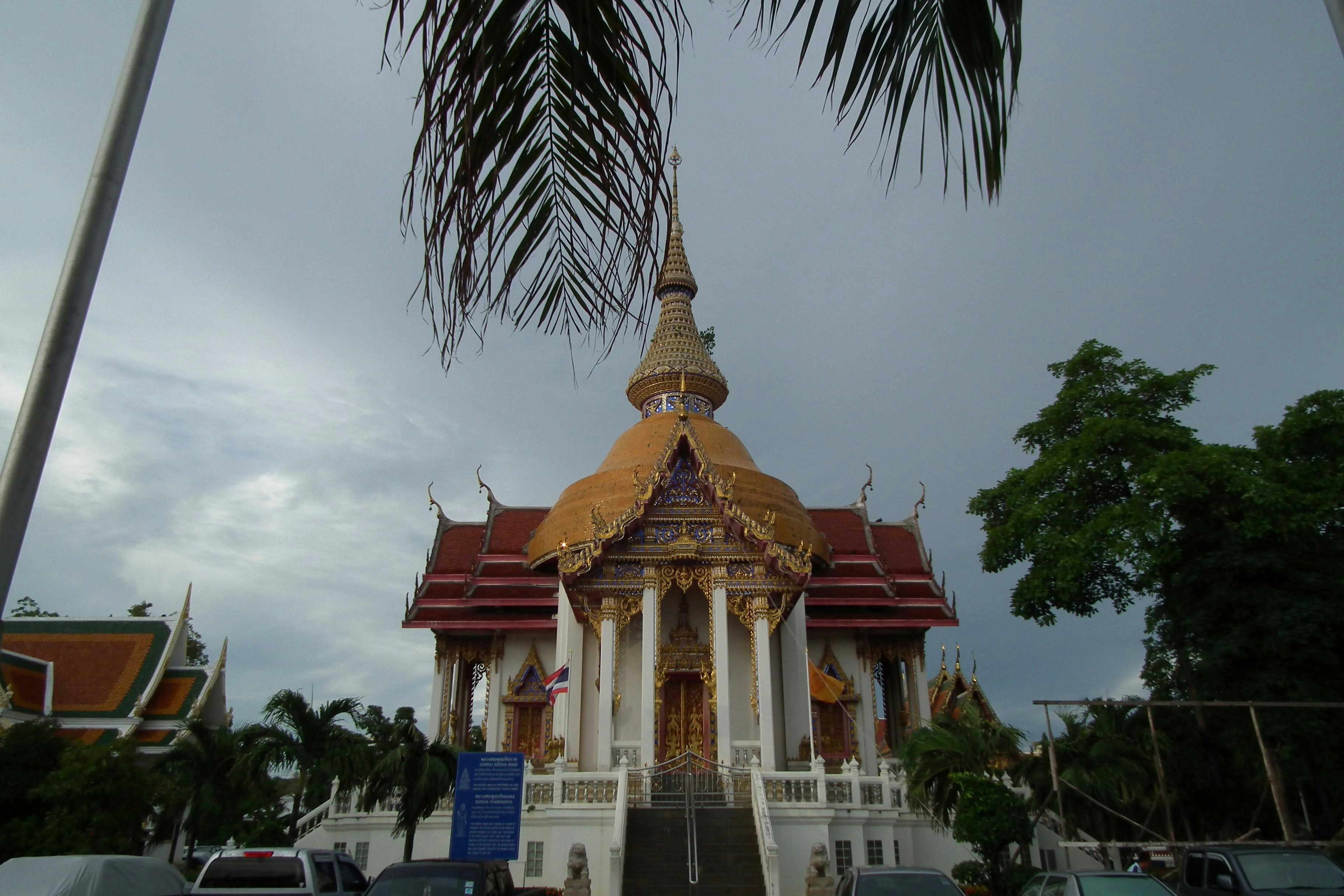 a very tall building with a golden roof