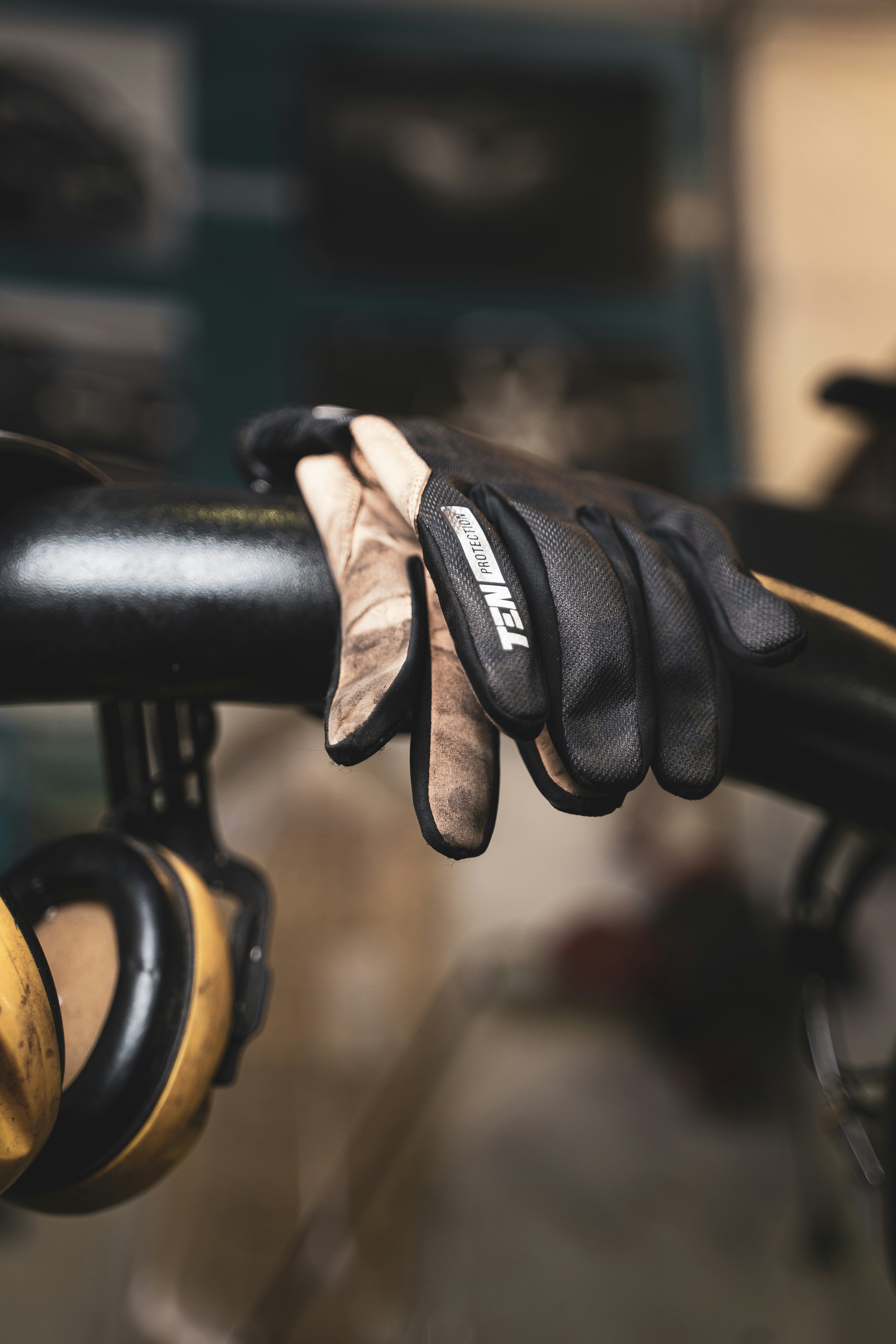 a close up of a pair of gloves on a bike