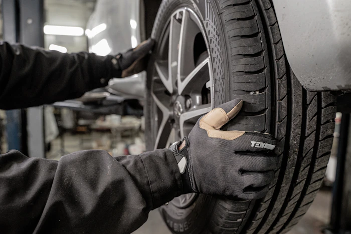 Mechanic fitting a tyre