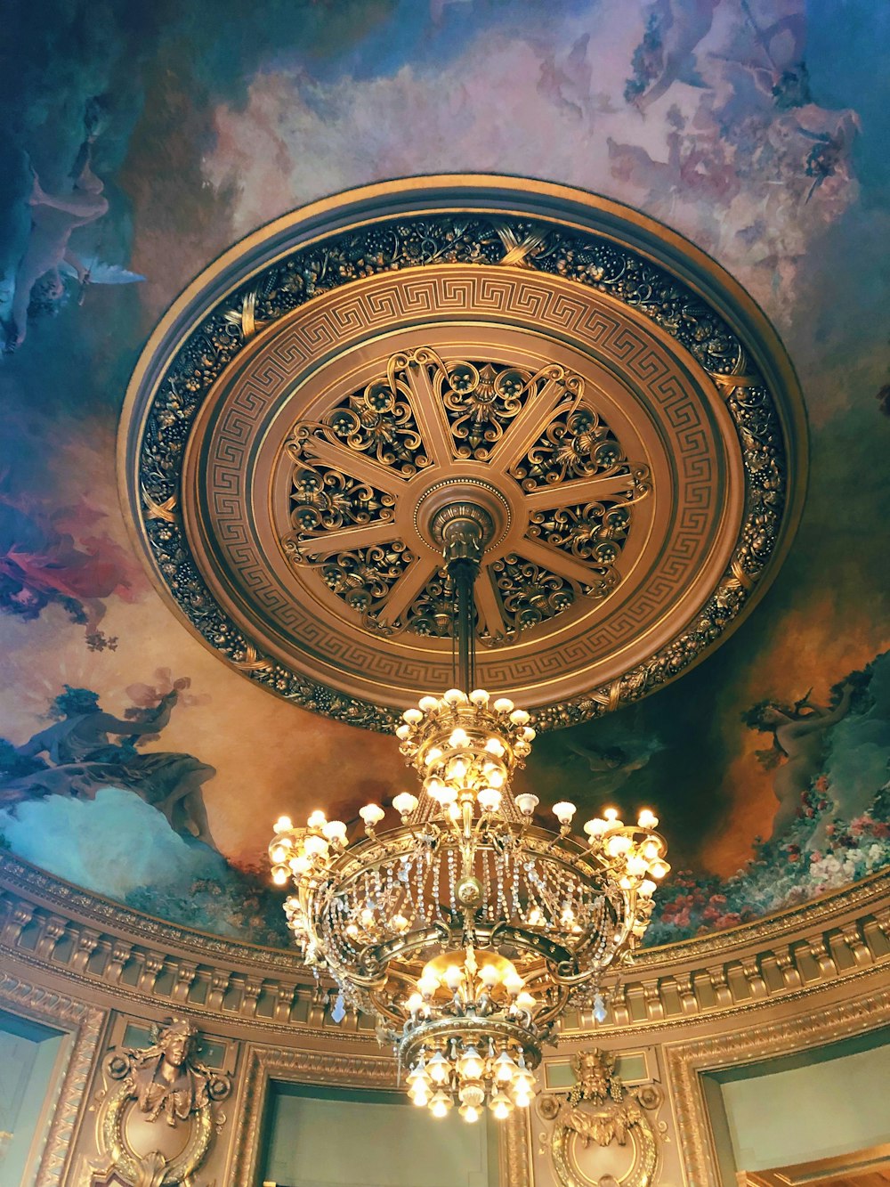 a chandelier hanging from the ceiling of a room