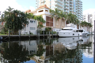 a large white boat is docked in the water