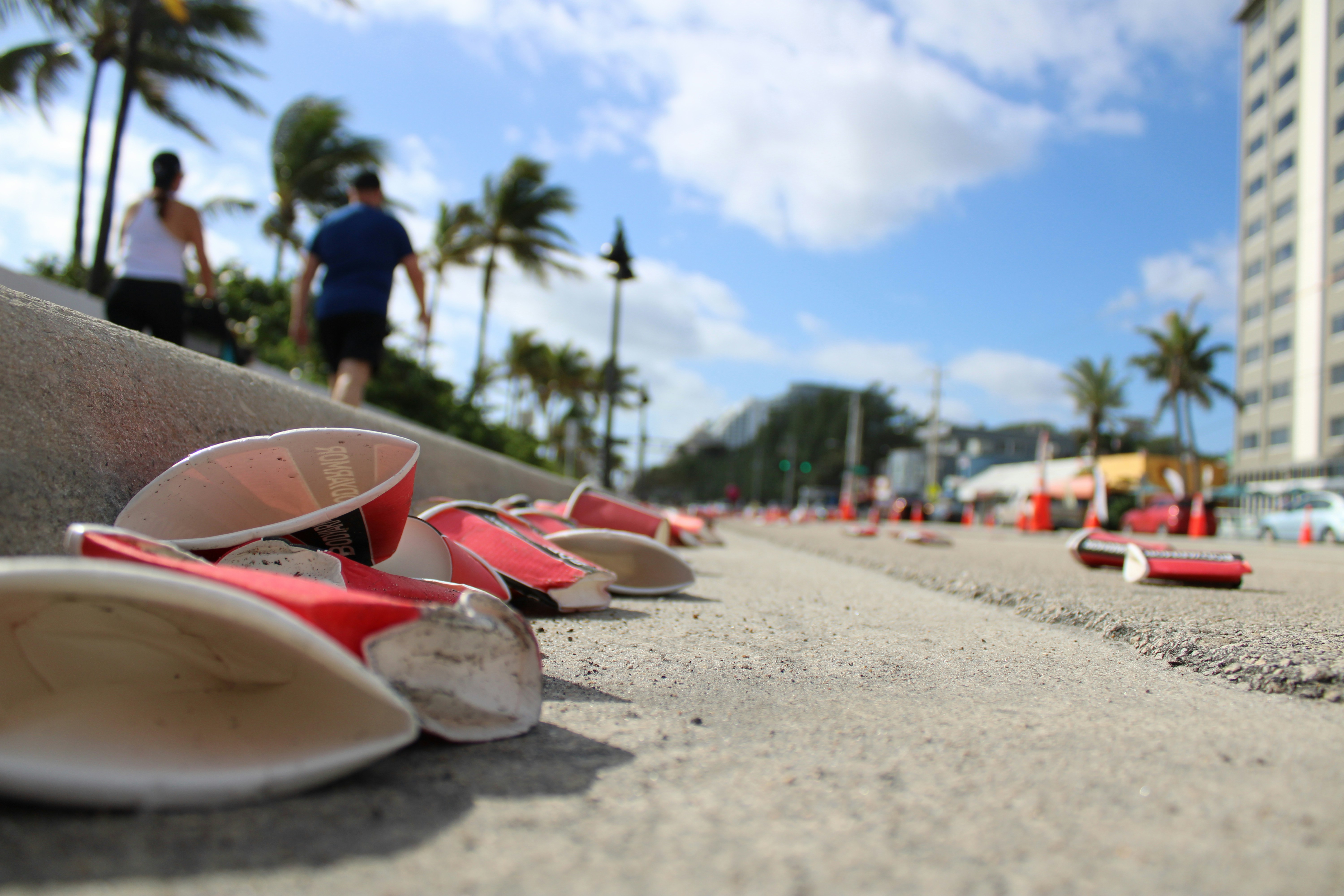a bunch of shoes that are laying on the ground