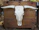 A rustic cow skull customized with floral patterns, displayed on a wooden wall.