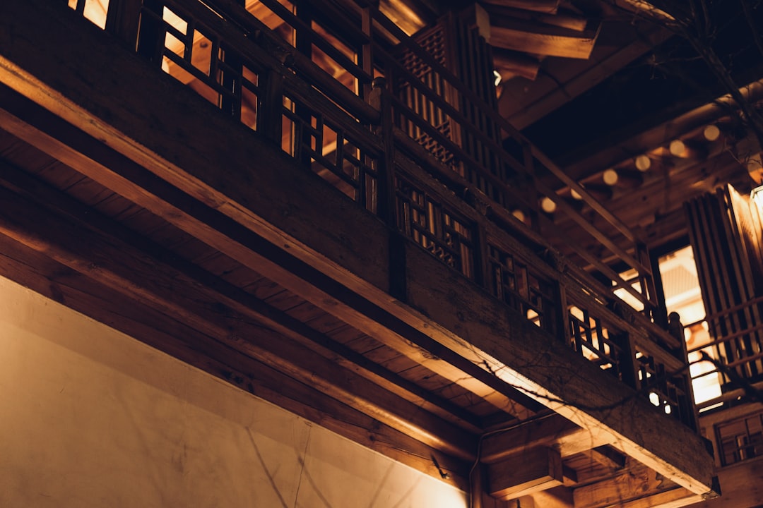 a room with a wooden ceiling and a clock on the wall,