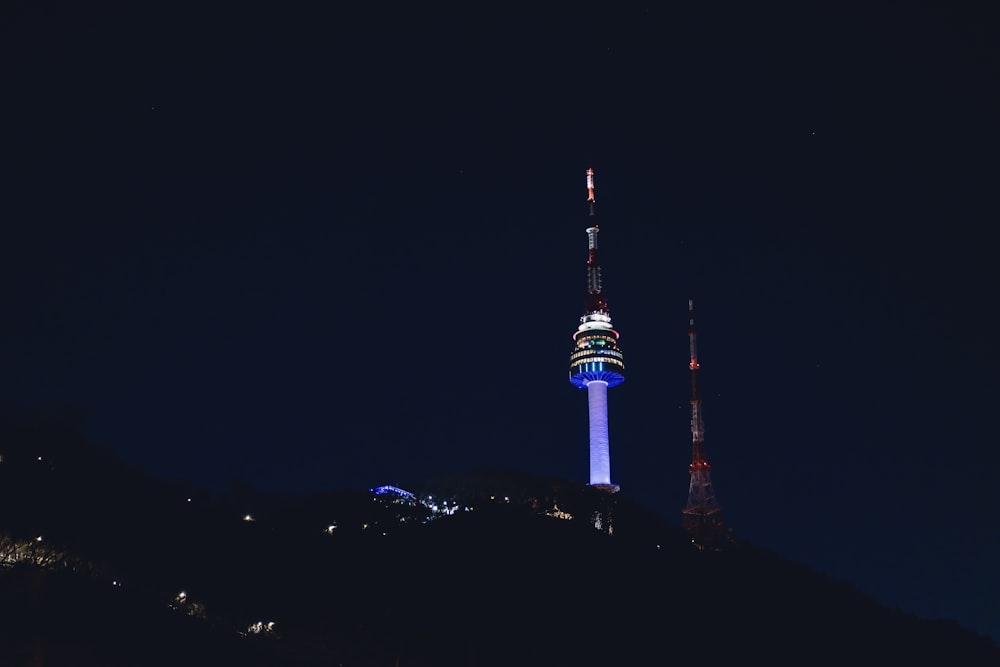 a very tall tower with a sky scraper on top of it