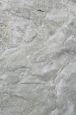 Close-up of a raw Polish flint stone with earthy textures and natural patterns.