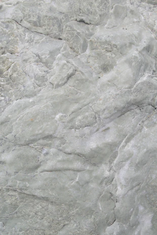 Close-up of a raw Polish flint stone with earthy textures and natural patterns.
