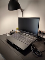 An elegant workspace featuring a laptop and accessories.