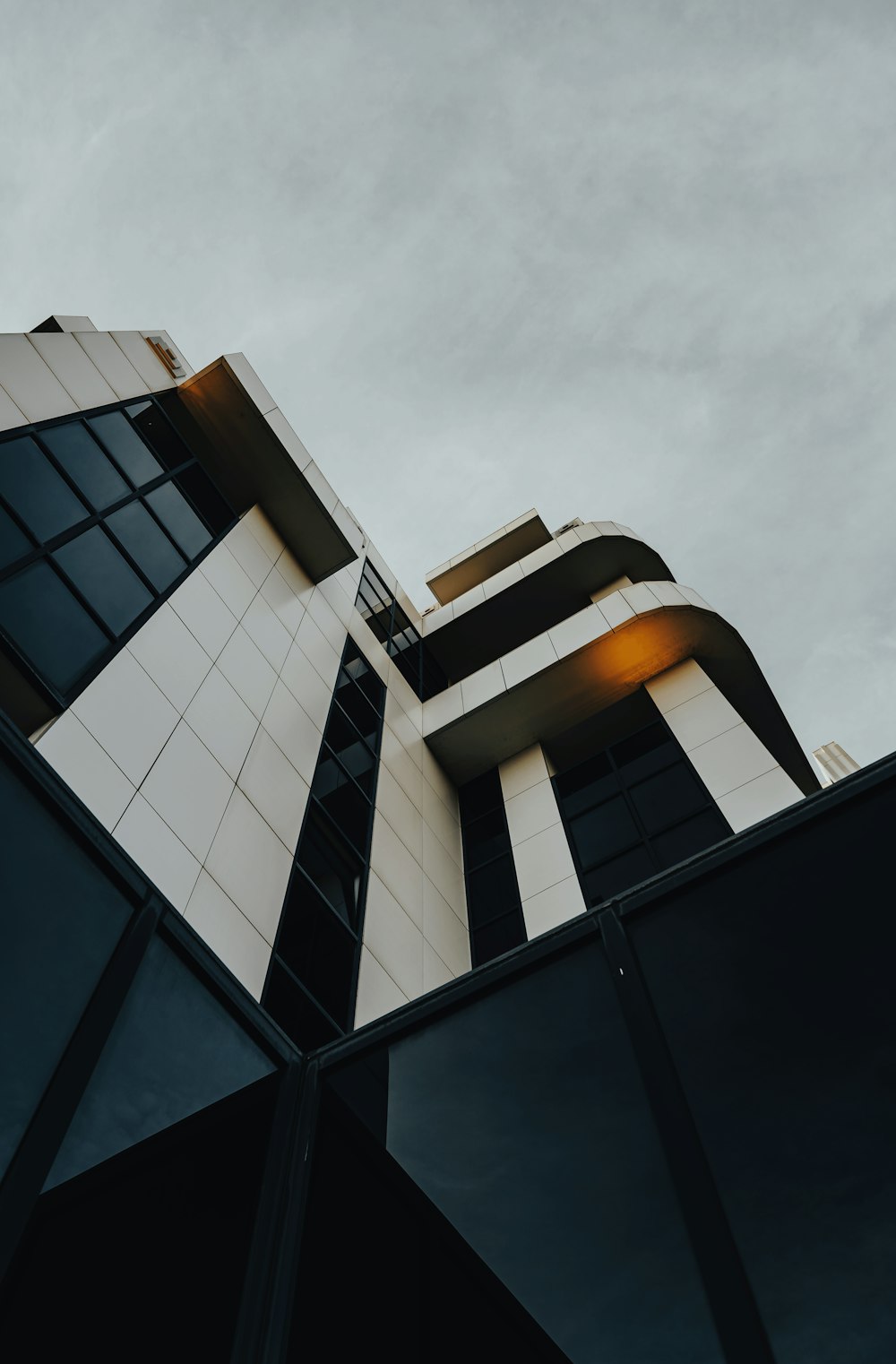 a tall building with a sky background