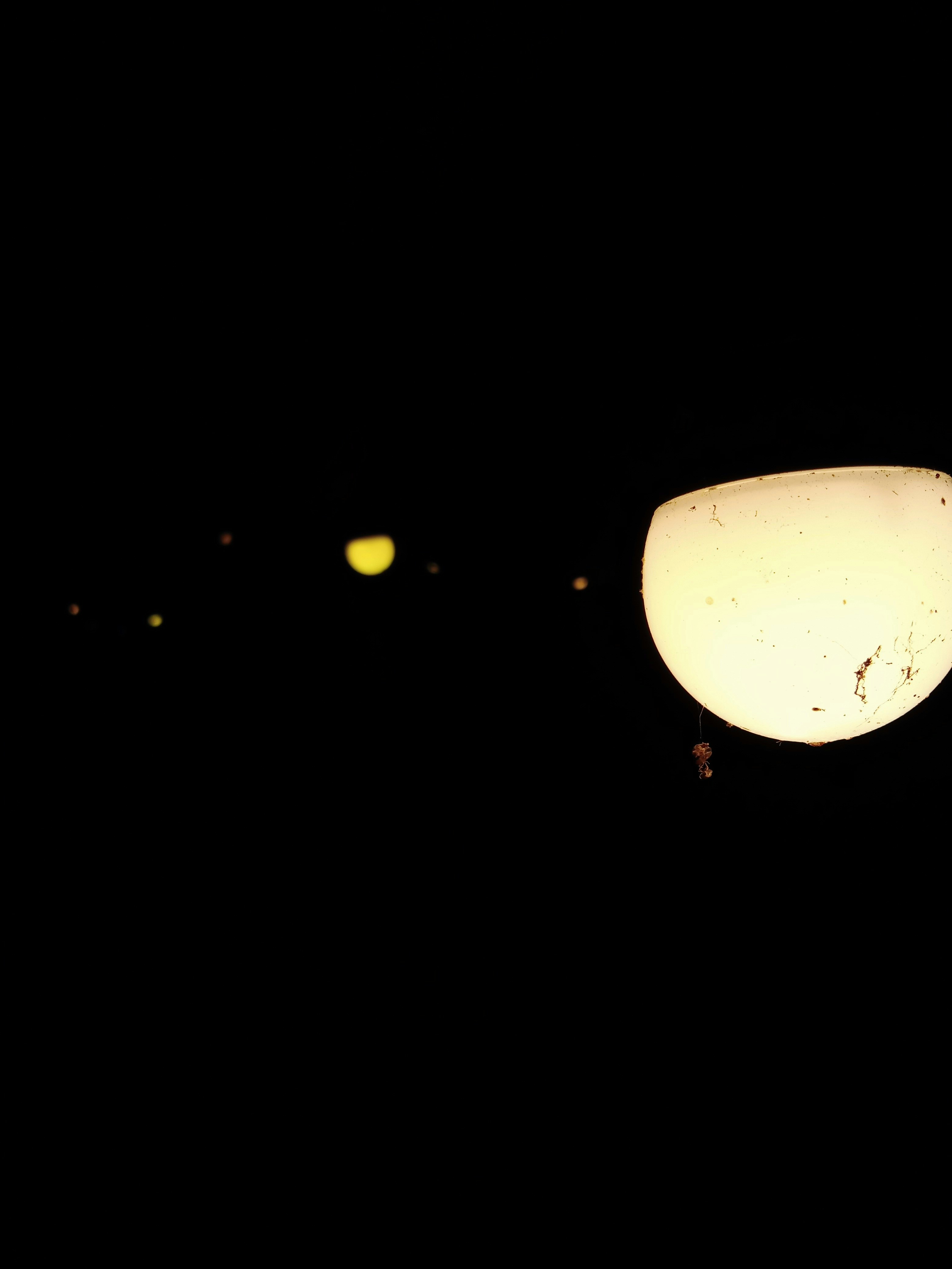 a street light is lit up in the dark