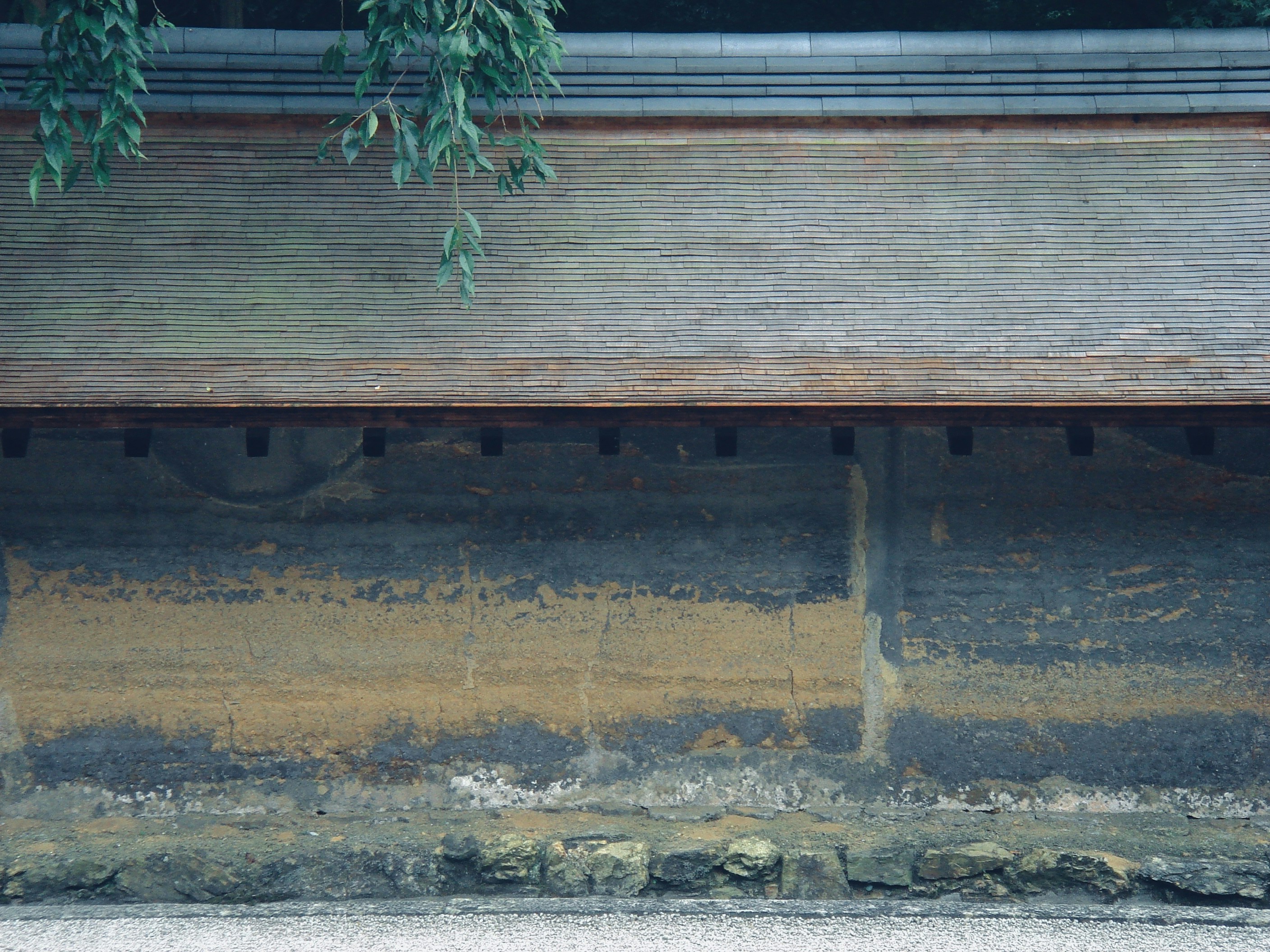 Old clay wall at Ryoanji temple im Kyoto, Japan