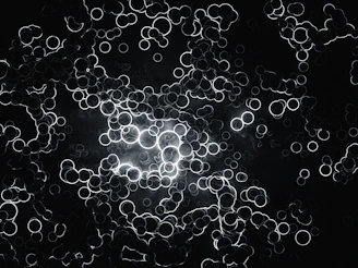 Close-up of intricate constellation patterns glowing softly on a dark background.