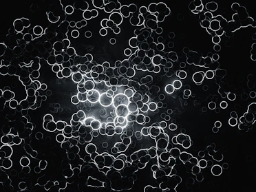 Close-up of intricate constellation patterns glowing softly on a dark background.