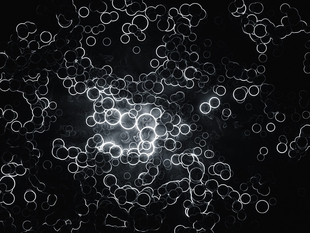 a black and white photo of a bunch of circles