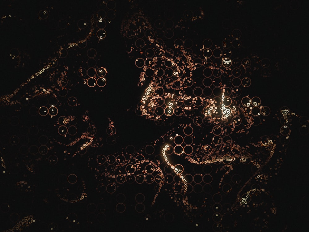 a black background with lots of circles and bubbles